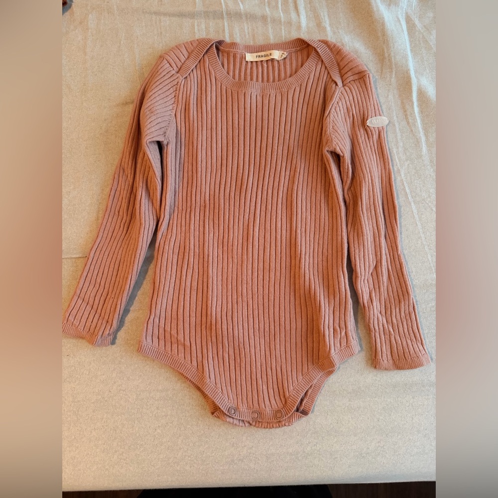 Fragile baby onesie